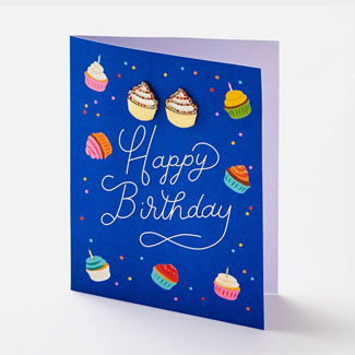 Vibrant blue birthday greeting card with illustrated cupcake design.